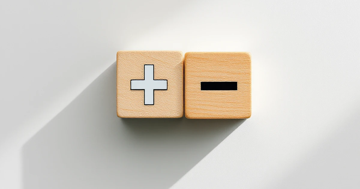 Wooden blocks with plus and minus signs